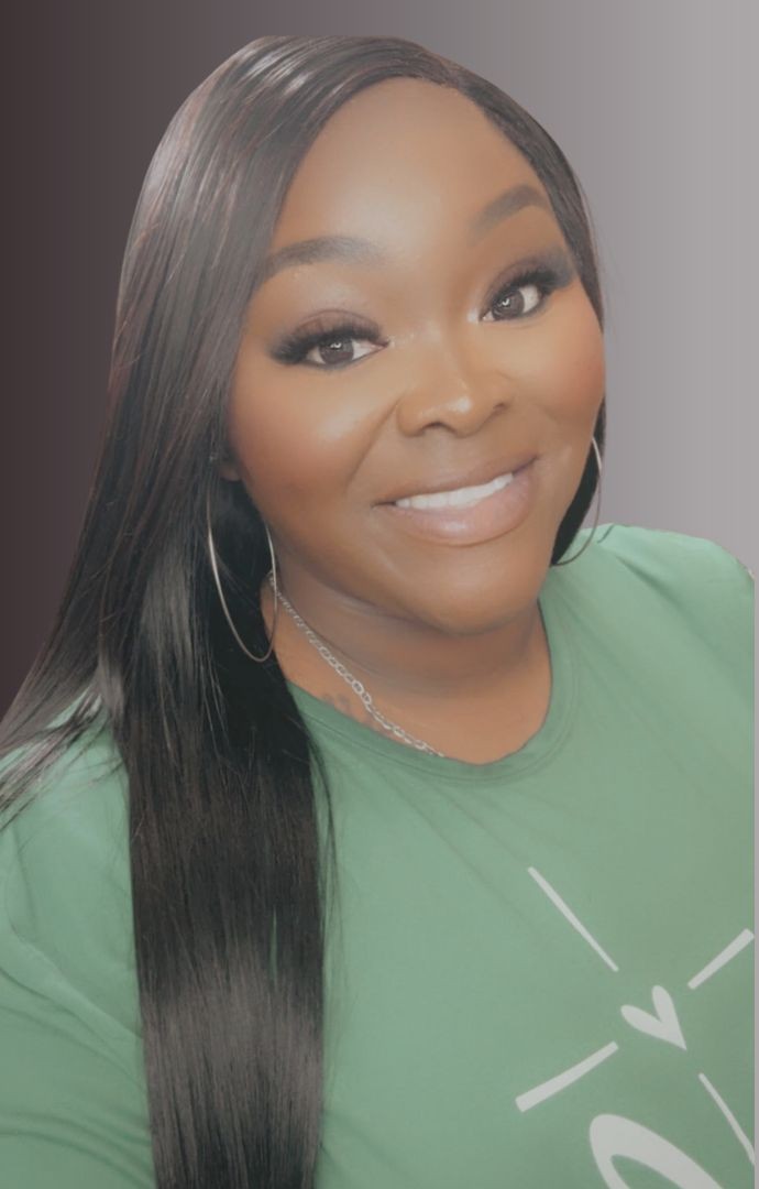 Your stylist at Hair By Song Bird, smiling in a green top